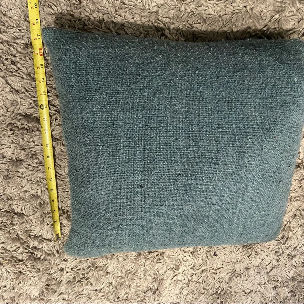 West Elm feather stuffed blue tweed pillow with wooden buttons